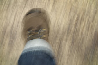 Blurry First-Person View of Running Foot on Wooden Floor