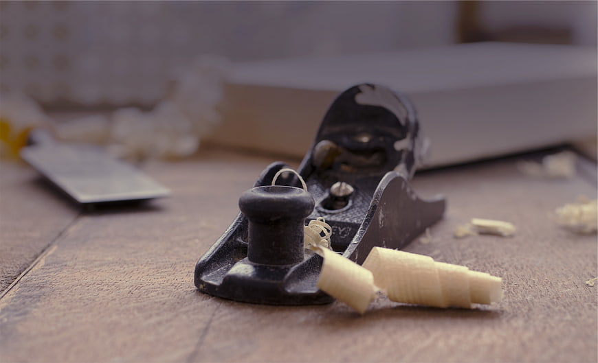 Vintage Woodworking Hand Plane with Wood Shavings