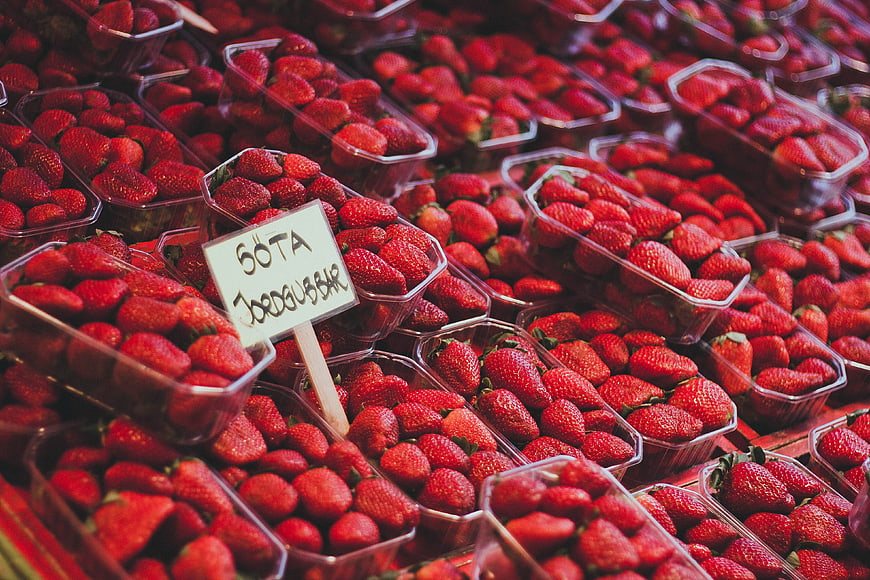 Fresh Strawberries in Plastic Containers at Market