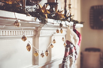 Cozy Christmas Fireplace Mantel with Gold Ornaments and Stockings