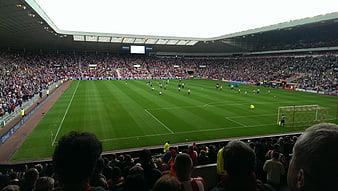 Wide View of Soccer Match in Packed Stadium
