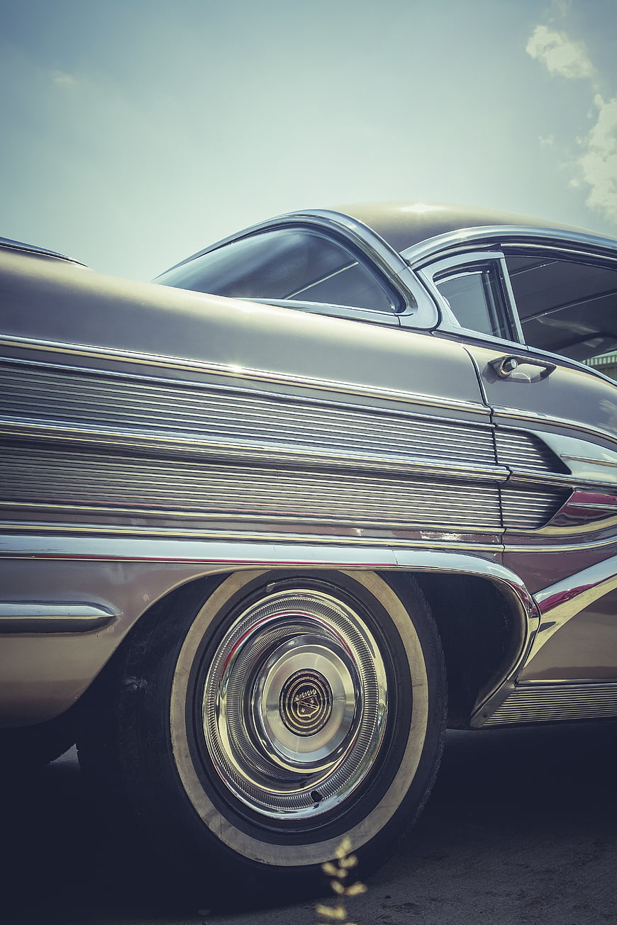 Close-up of vintage classic car wheel and chrome details