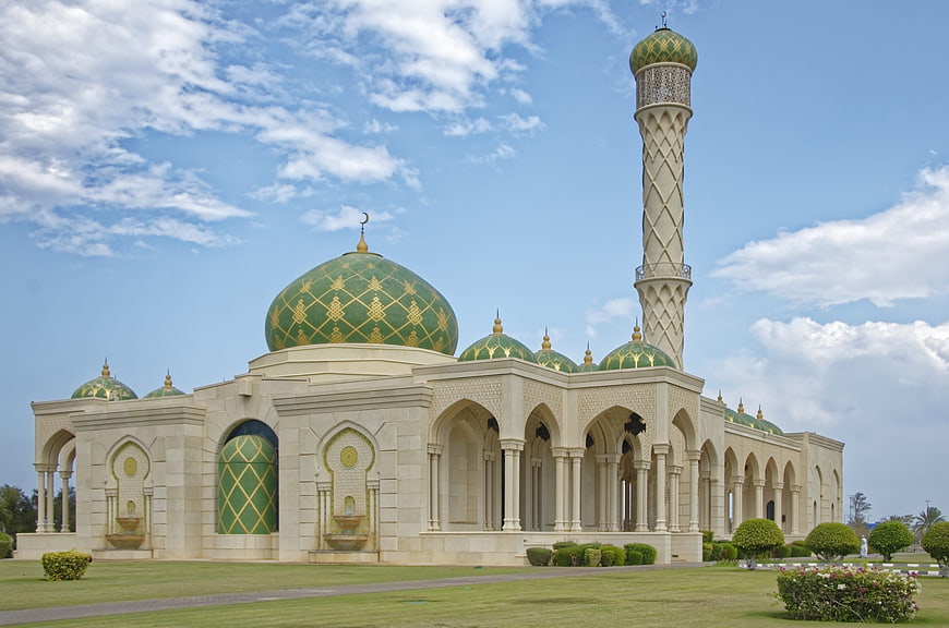 Zulfa Mosque in Muscat, Oman with green domes and tall minaret