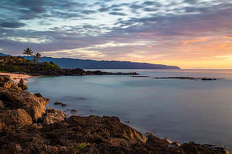 Long Exposure Sunset at Tropical Rocky Coastline