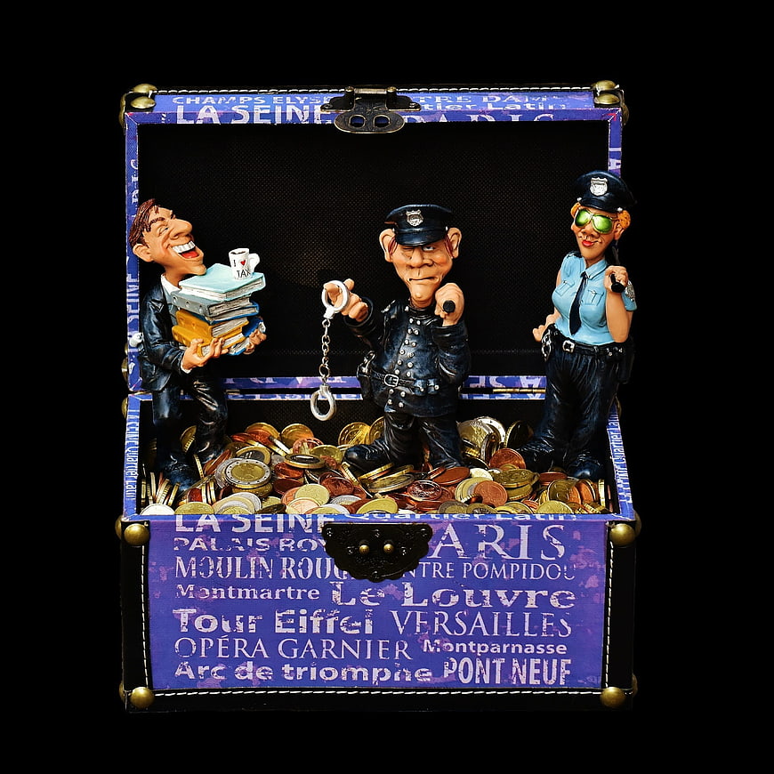 Humorous Parisian Tax Evasion Figurines in Decorative Treasure Chest