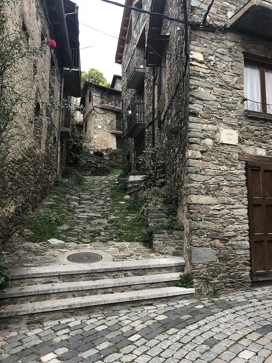 Narrow cobblestone street in historic stone village