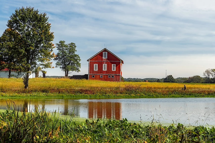 Red Barn Reflected in Pond with Autumn Trees