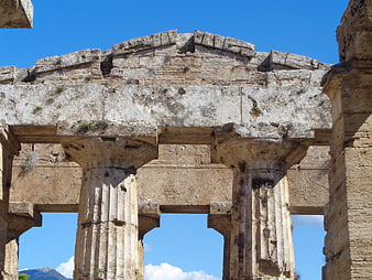 Ancient Greek Temple Ruins with Stone Columns and Blue Sky