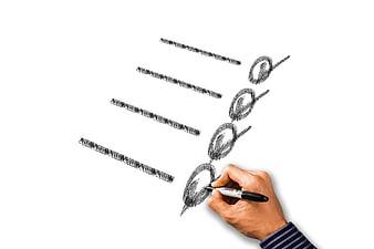 Hand sketching checklist with marker on white background