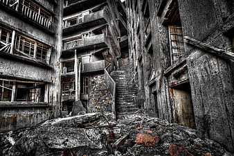 Abandoned concrete staircase in derelict industrial building