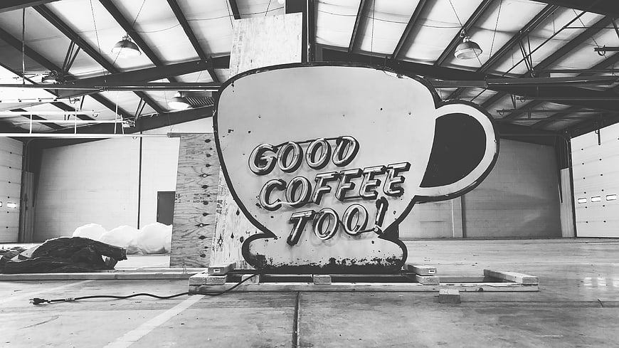 Vintage Neon Coffee Cup Sign in Warehouse