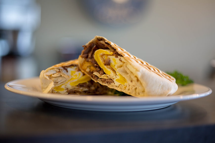 Grilled Beef and Cheese Wrap on White Plate