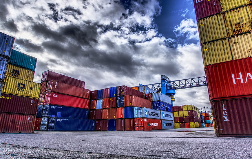 Colorful Stacked Shipping Containers at Industrial Port Terminal
