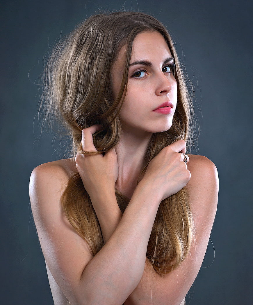 Studio Portrait of Young Woman With Long Brown Hair