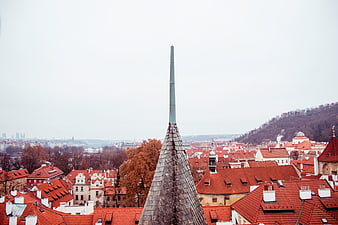 Prague cityscape with red roofs and church spire