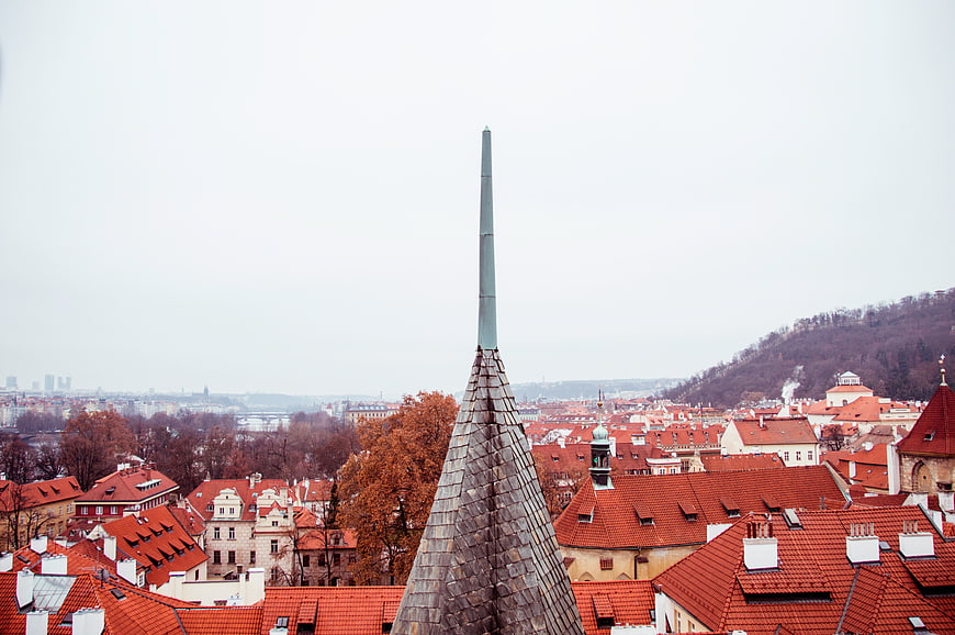 Prague cityscape with red roofs and church spire