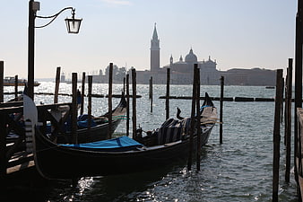 Gondolas moored in Venice lagoon with San Giorgio Maggiore in background