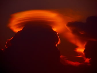 Dramatic Lenticular Cloud Silhouette at Fiery Sunset