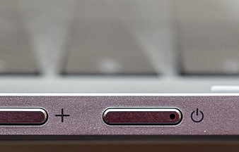 Close-up of Rose Gold Laptop Power Button and Volume Controls