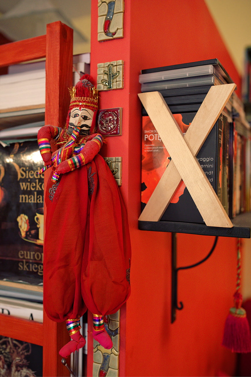 Traditional red marionette puppet hanging in a bookstore