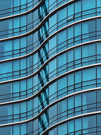 Abstract Blue Curved Glass Office Building Facade