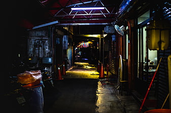 Atmospheric Night Alley with Neon Lights and Wet Pavement