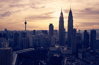 Kuala Lumpur Skyline Featuring Petronas Towers at Sunset
