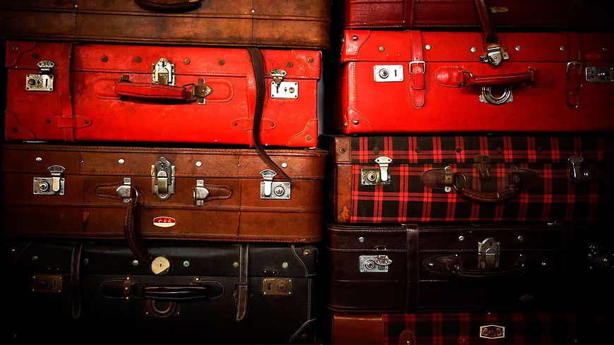 Stack of Vintage Leather Suitcases and Trunks