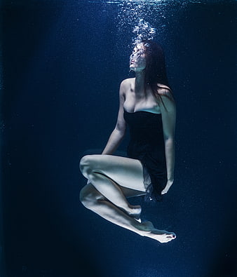 Underwater Portrait of Woman in Black Dress with Bubbles