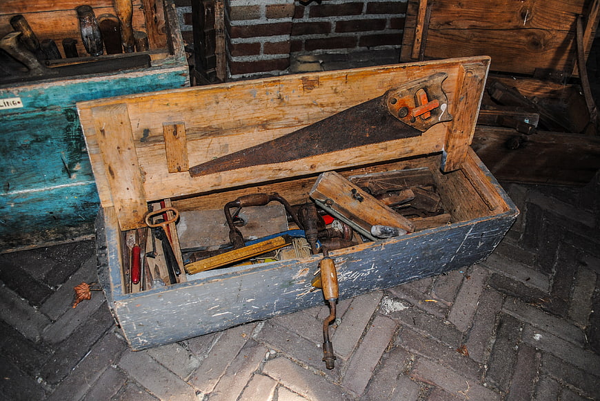Vintage wooden toolbox with antique carpentry tools