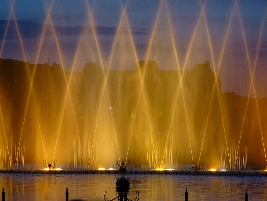 Illuminated fountain jets at dusk in Lunéville