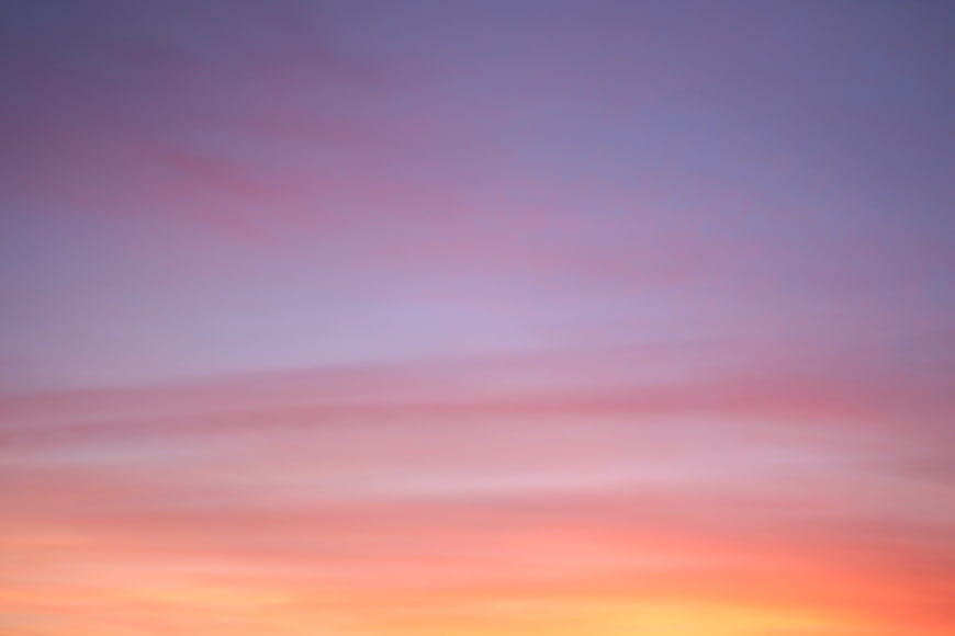 Soft pastel sunset sky with pink and purple clouds