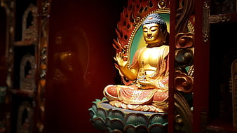 Golden Buddha Statue in Red Temple Niche