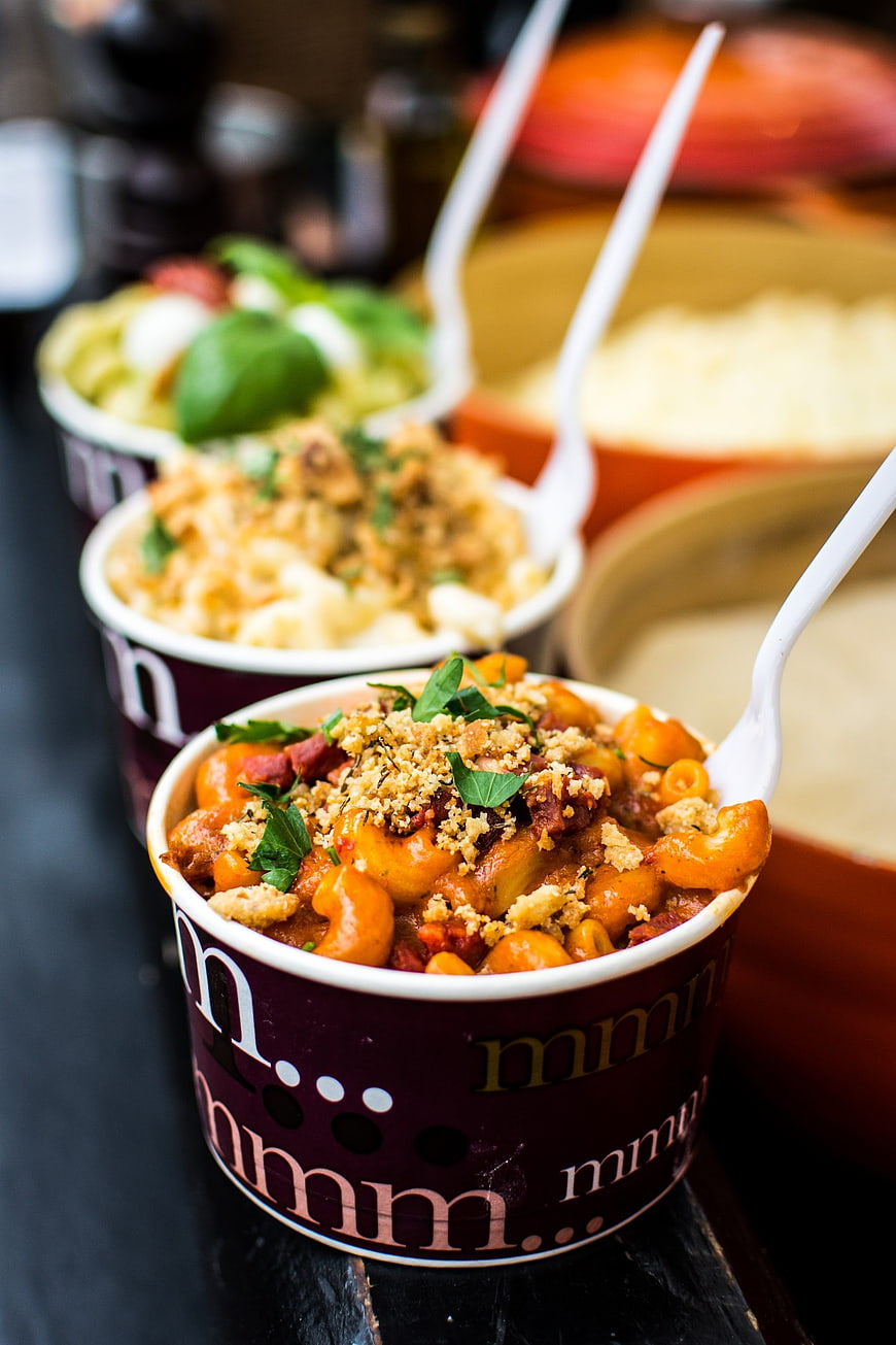 Close-up of Italian pasta dishes in takeaway cups