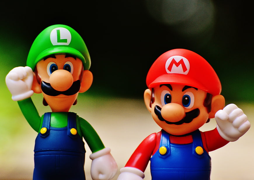 Mario and Luigi Action Figures with Blurred Background