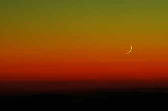 Crescent Moon in Vibrant Orange and Green Gradient Sky