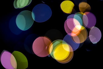 Abstract colorful bokeh lights on black background