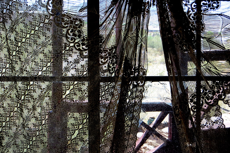 Black lace curtain pattern with floral design