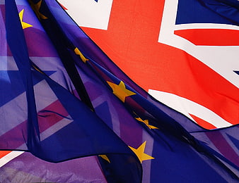 Close-up of overlapping European Union and United Kingdom flags