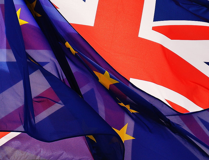Close-up of overlapping European Union and United Kingdom flags