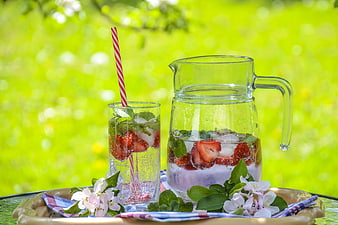 Refreshing Strawberry Mint Lemonade Pitcher and Glass Outdoors
