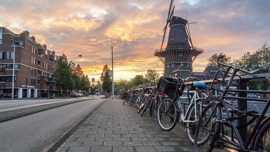 Dutch Windmill and Bicycles at Sunset