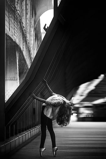 Ballerina Performing Backbend in Urban Tunnel