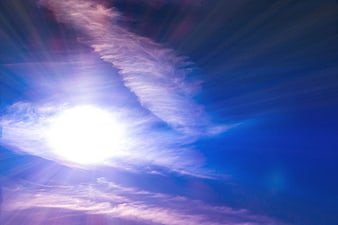 Dramatic Sunburst Through Purple and Blue Clouds