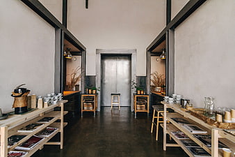 Modern industrial interior with wooden shelves and metal door