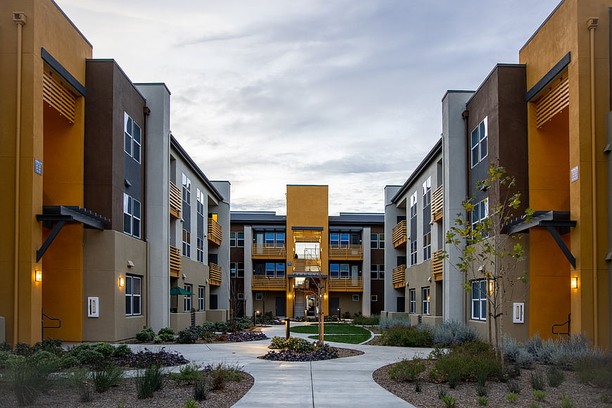 Modern Apartment Complex Courtyard at Dusk