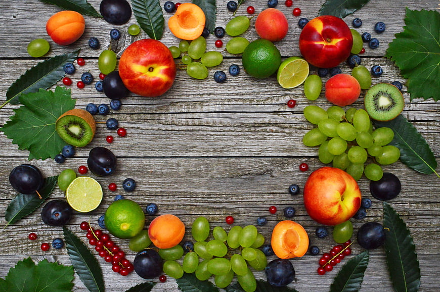Fresh Fruit Border On Rustic Wooden Table With Copyspace