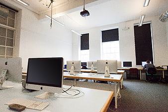 Empty Computer Lab with Apple iMacs and Student