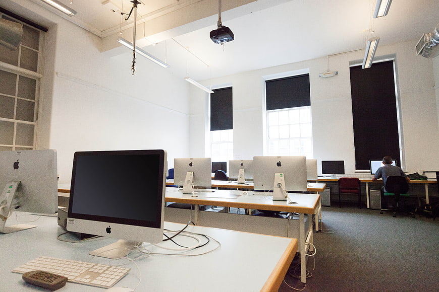 Empty Computer Lab with Apple iMacs and Student