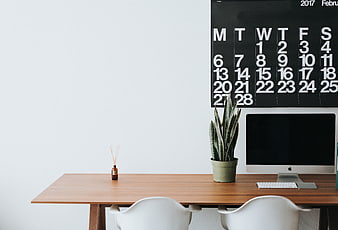 Minimalist Office Desk with Calendar and Plant